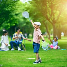 An image of a child playing badminton in the park with their friends and family enjoying a picnic.