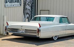 Image result for 04 White Cadillac DeVille On Flat Bed Truck