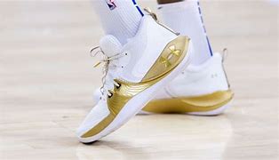 Image result for Joel Embiid Gold and White Shoes