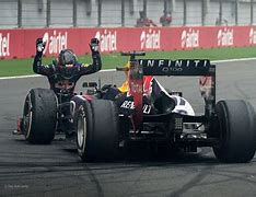 Image result for Sebastian Vettel Bowing to Car