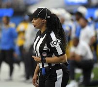 Image result for A Picture of a Black Referee Throwing a Flag