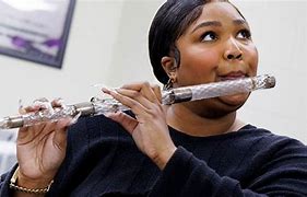 Image result for Lizzo Outfits Playing Flute