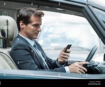 Image result for Man Looking at Cell Phone