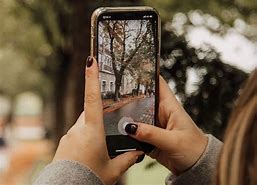 Image result for Holding iPhone Camera