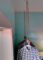 Image result for Hanging Clothes Rod From Ceiling