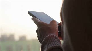 Image result for Back View of Woman Holding Phone