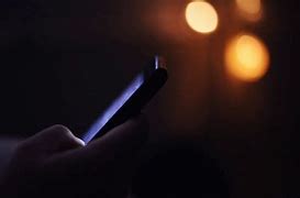 Image result for Person On Phone in Dark