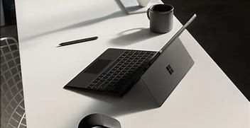 Image result for Microsoft Studio Laptop Table