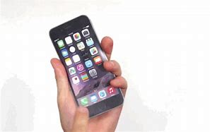 Image result for Picture of an iPhone 6 White in Color and Flat On a Surface