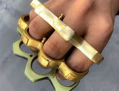 Image result for Woman with Brass Knuckles