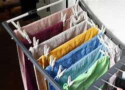 Image result for Wall Mounted Drying Rack and Ironing Board