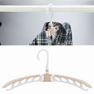 Image result for Folding Clothes Hanger Black Whith Overcoat