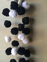 Image result for Black and White Pom Poms in Baggie for Baby