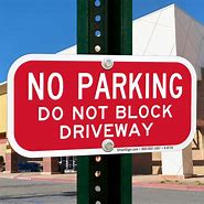 Image result for No-Parking Do Not Block Driveway Sign