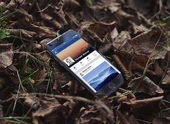 Image result for iPhone in Hand Outside