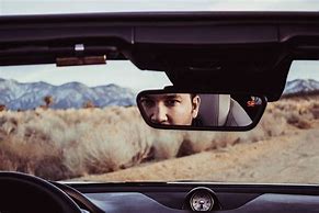 Image result for Looking in Rear View Mirror
