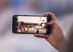 Image result for Person Using Cell Phone Camera