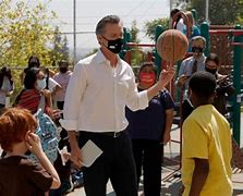 Image result for Gavin Newsom Giving XI Basketball Jersey