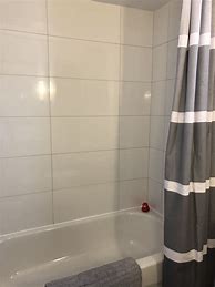 Image result for Large White Tiles Grey Grout Bathroom