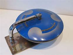 Image result for What Is a Vintage Large Round Metal Object with a Hook in It
