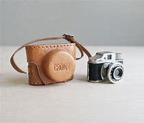 Image result for Old Miniature Canon Camera