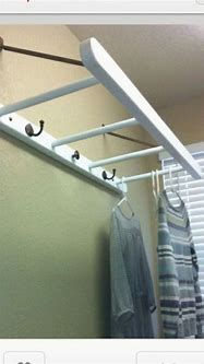Image result for Laundry Room Under Cabinet Hang Rod