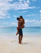 Image result for Couple Wresting Beach