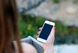 Image result for Holding an iPhone