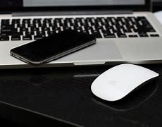 Image result for iPhone beside Laptop