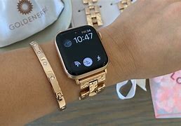 Image result for Black Apple Watch with Gold Bracelet