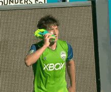 Image result for Sounders Holding Shoe as Phone
