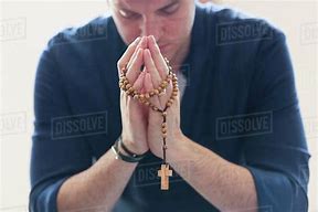 Image result for Man Praying the Rosary