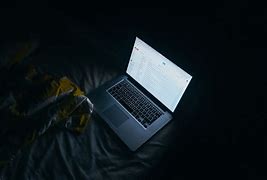 Image result for MacBook Pro at Bed Dark