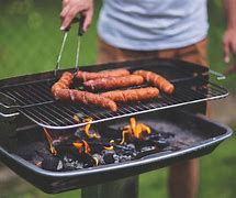 Image result for Hanging Sausage in a Traeger Smoker