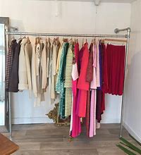 Image result for Clothes Rack Against Wall