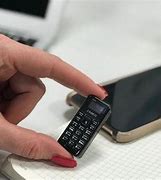 Image result for Tiny Flip Cell Phone