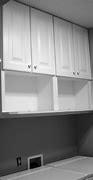 Image result for Wall Mounted Laundry Cabinets