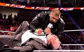 Image result for Triple H vs Brock Lesnar