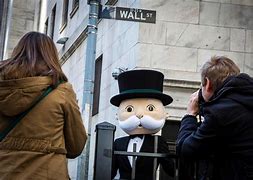 Image result for Bid to limit bonus pay on Wall Street
