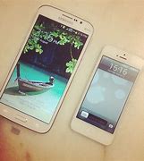 Image result for Galaxy Mega vs iPhone 6 Plus