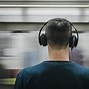 Image result for Holding One Headphone Ear Up