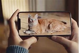 Image result for Holding iPhone XS Max