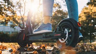 Image result for Electric Scooter with Ride Written On Pole