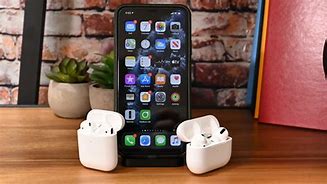 Image result for iPhone with AirPods
