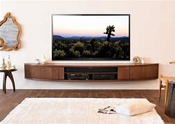 Image result for Entertainment TV Stand with Figurines On It Photo