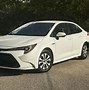 Image result for Toyota Corolla Hybrid Hatchback 2019 Brown