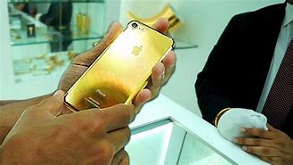 Image result for Golden iPhone with Air Pods and From Dubai