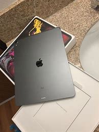 Image result for Apple Laptop in Table