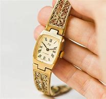 Image result for Royal Blue Watch with Gold Filigree Face
