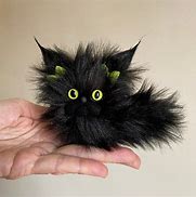 Image result for Fuzzy Black Cat On Phone